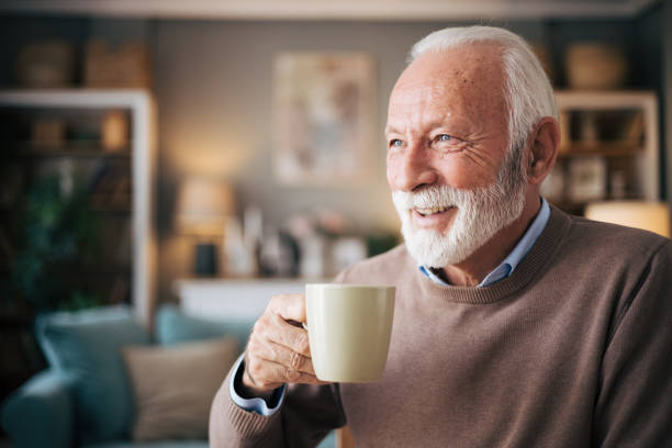 istock Elderly bearded man drinking coffe in the dining room 1850534843