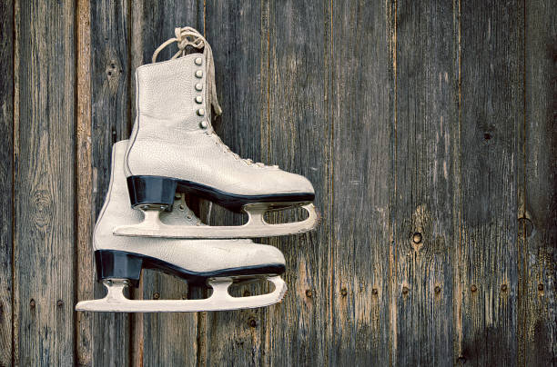 istock Old ice skates on wooden wall 185053598