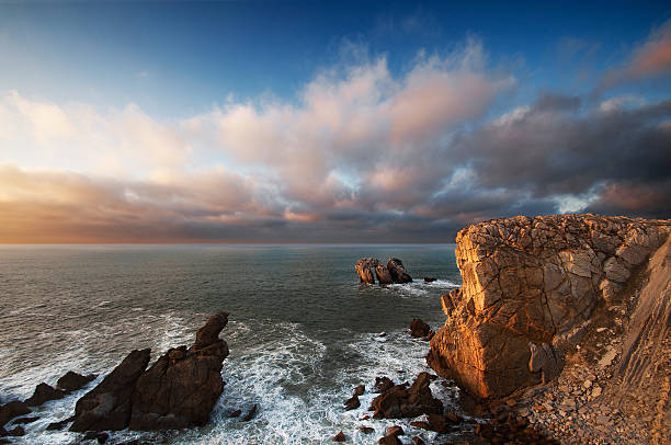 istock Beautiful sunset on the cliffs of Liencres, Cantabria, Spain 185053676