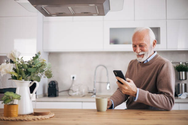 istock Senior man drinking morning coffee at his domestic kitchen 1850540601