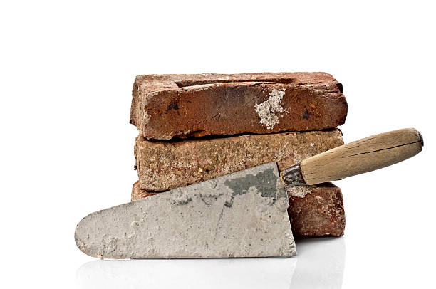 istock Dirty Red Brick and Trowel 185054361