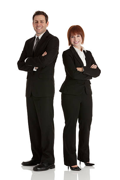 istock Happy business executives standing with arms crossed 185054668