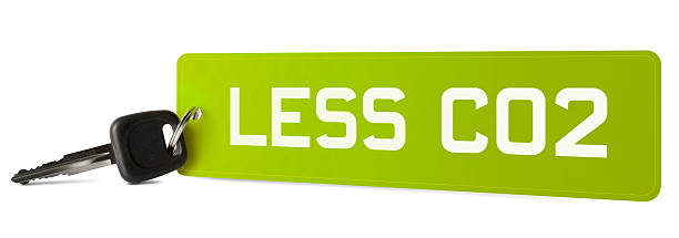 The words LESS CO2 on European style car registration plate keyring. Isolated on a pure white background, absolutely no dot in the white area no need to cut-out e.g. can be dropped directly on to a white web page seemlessly. 