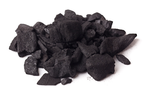 Pure Charcoal / Carbon isolated on white. By-product of burnt timber. Also used in  horticulture to improve drainage and sweeten soil.