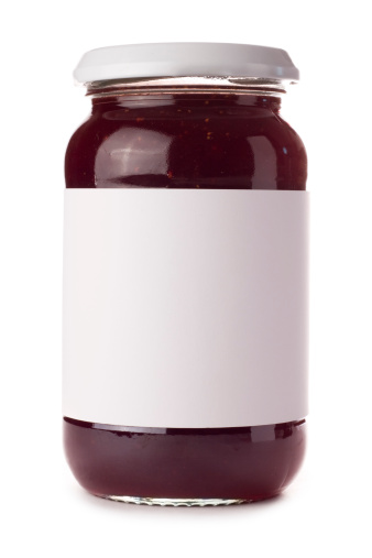 Jam jar with a blank label isolated on a white background. Ideal for imposing your own artwork onto.