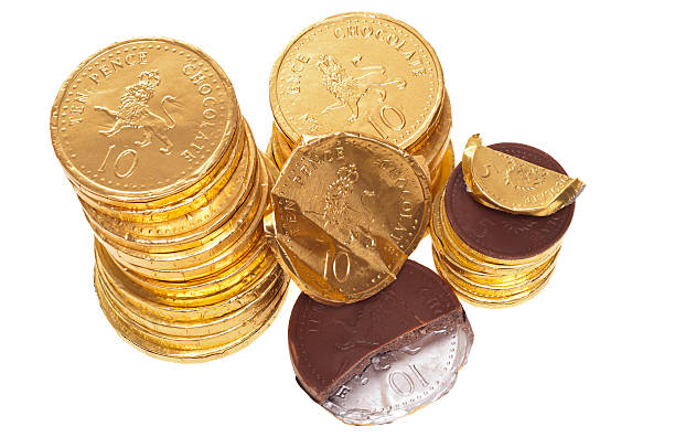 istock Chocolate money coins stacked on white 185056333