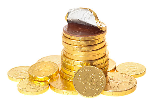 istock Chocolate money coins stacked on white 185056474
