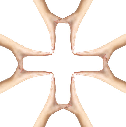 Big Medical Cross symbol from hands isolated