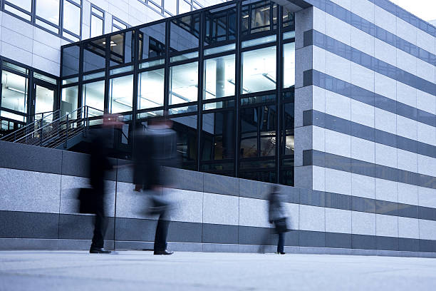 istock Blurred Business People  Walking Past Striped Wall 185057013