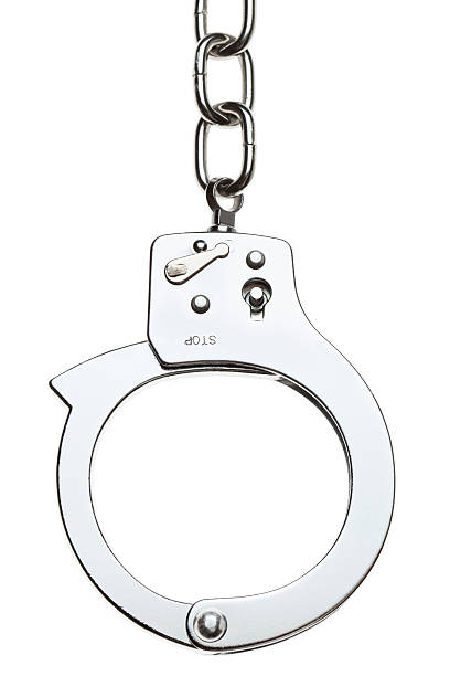 Close-up of stainless handcuff with a chain