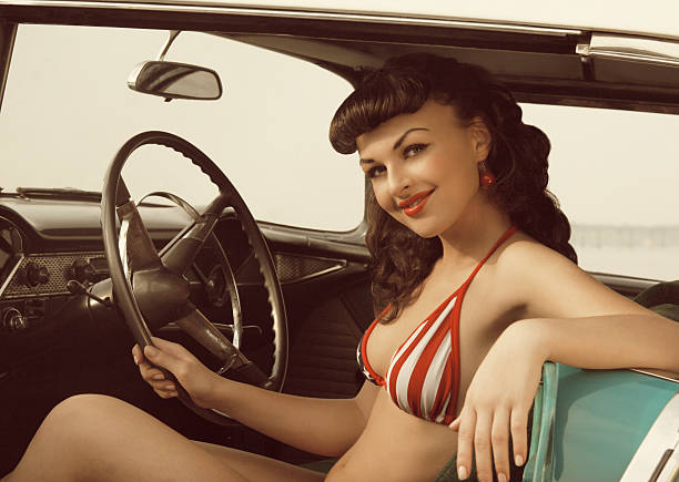On the Road Again. Emulations of vintage style photography.See full Lightbox pin up girls and cars stock pictures, royalty-free photos & images