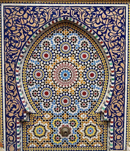 Traditional Moroccan fountain Traditional Moroccan fountain with mosaic tiles found outside a mosque in the souk of Rabat casablanca stock pictures, royalty-free photos & images