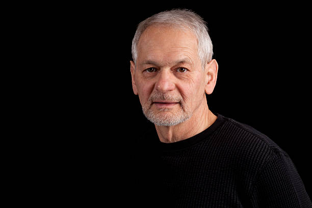 istock Senior man with beard and gray hair looking at camera 185058308