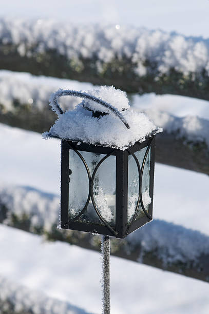 istock Snow covered outdoor candle light 185058779