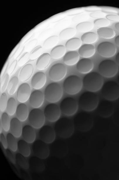 istock Texture of white golf ball exaggerated by side lighting 185059032