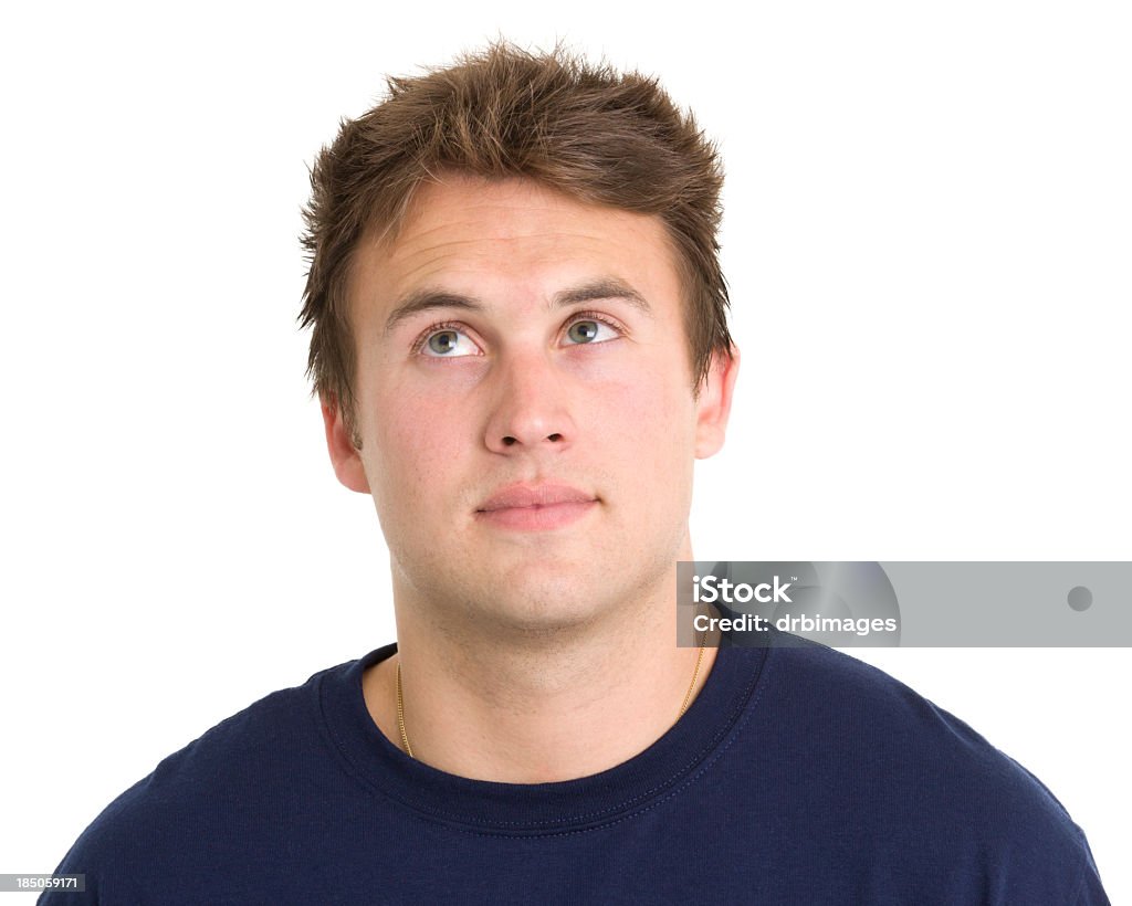 Young Man Looks Up in Thought Portrait of a young man on a white background. http://s3.amazonaws.com/drbimages/m/ec.jpg Men Stock Photo