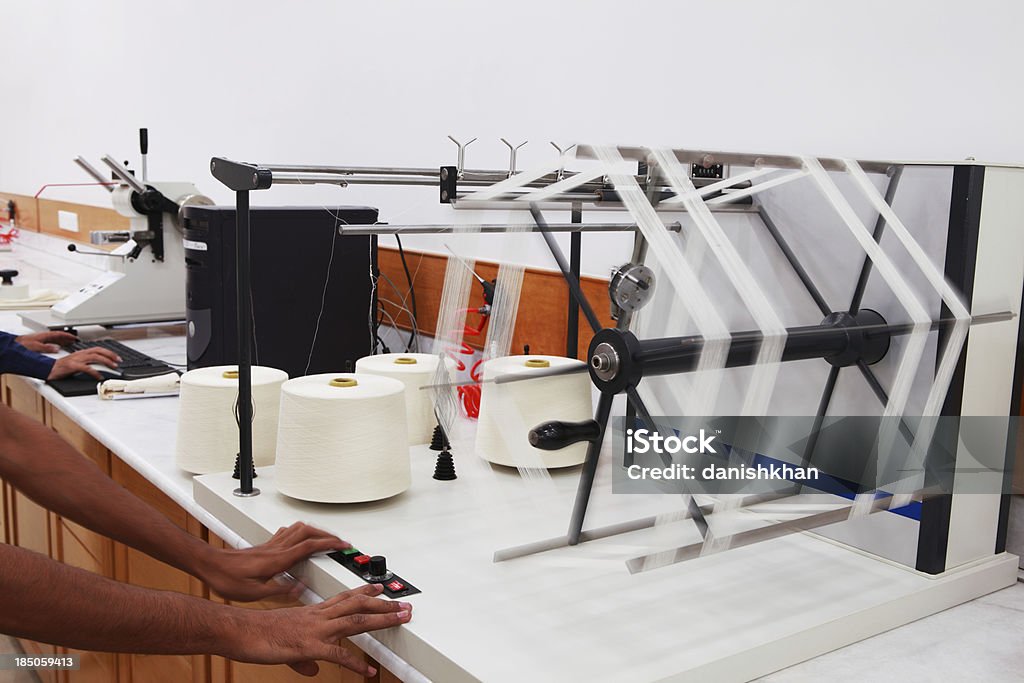 Textile Industry - Laboratory Thread strength tester in a textile mills laboratory. Textile Stock Photo