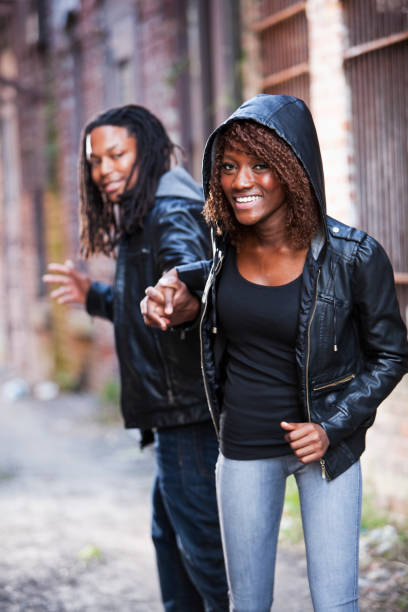 istock Young black couple in old alleyway 185060406