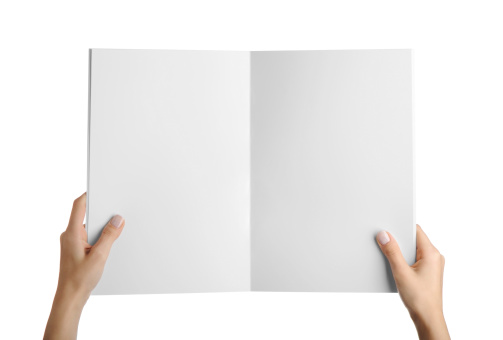 Hands holding blank magazine page for insertion of any document or text.isolated on a white background.