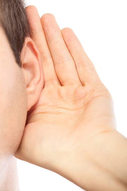 istock Young man listening to gossip 185060821