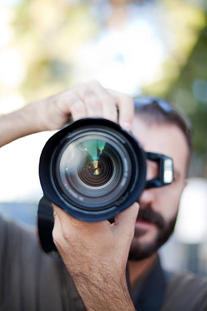 istock photographer and lens close up 185061296