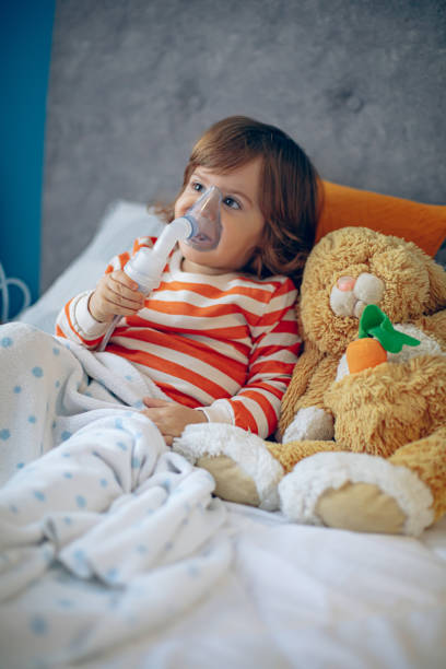 istock Little boy having inhalation at home 1850613540