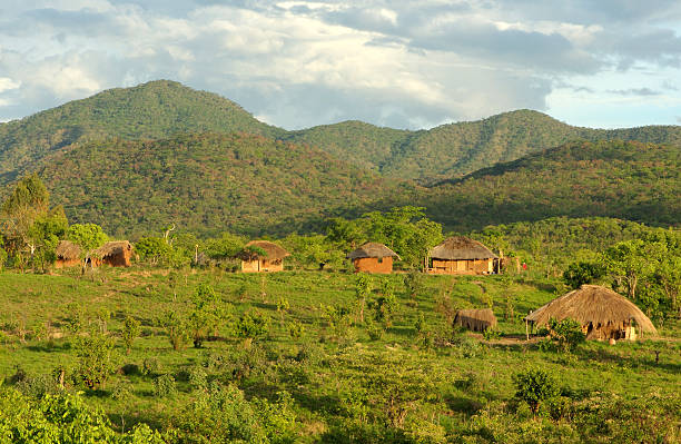 African huts in hills stock photo