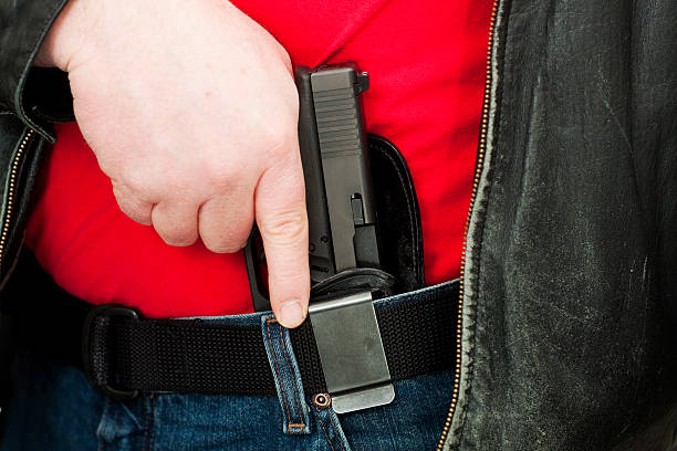 istock Concealed Carry Firearm Drawn From an Inside-the-Waistband Holster 185061416