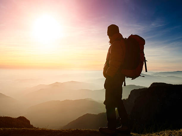 istock hiker admiring the sunset 185061608