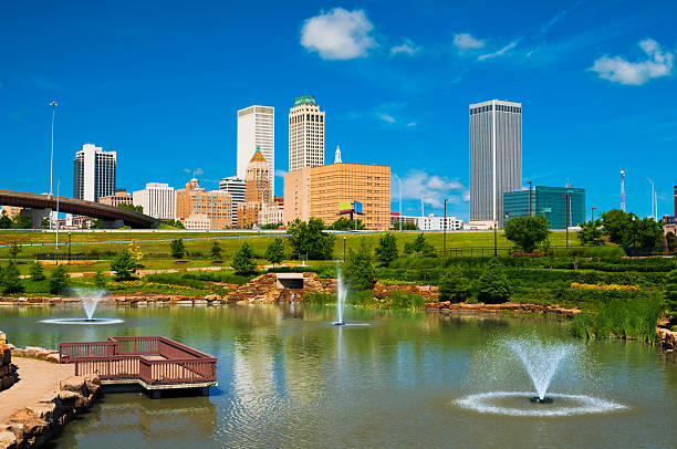 Tulsa skyline, pond, and fountains stock photo