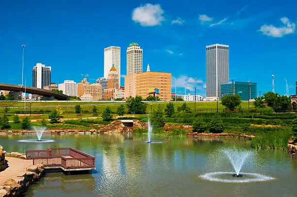 Photo of Tulsa skyline, pond, and fountains