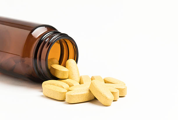 vitamina - vitamin pill vitamin c nutritional supplement bottle fotografías e imágenes de stock