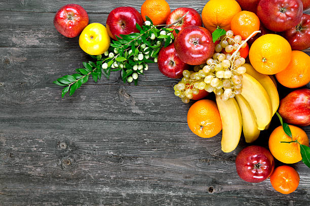 Fresh fruits Fresh fruits on a wooden table fruit bowl stock pictures, royalty-free photos & images