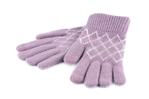 Pink winter gloves isolated on white background.