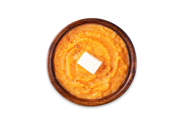 istock Cooked sweet potato puree in a bowl on a white isolated background 1850622877