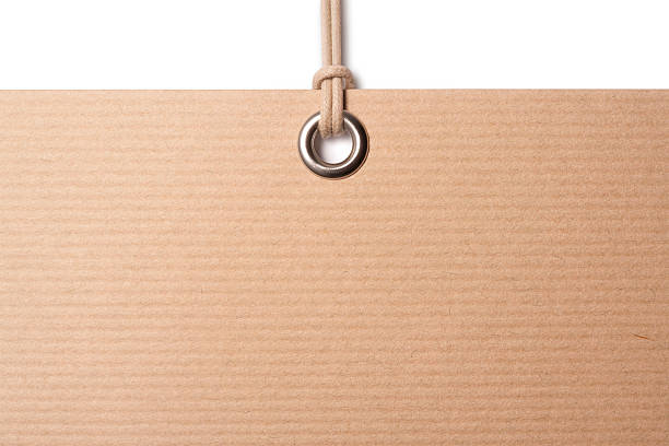 istock Blank brown card label hanging from tag 185062522