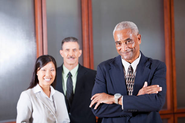 istock African American businesman with colleagues 185062556
