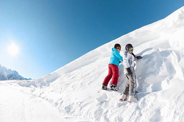 istock Happy kids playing in the snow 185062761
