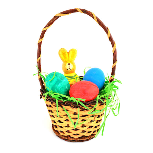 istock Easter eggs with bunny in wooden basket on white background 185063974