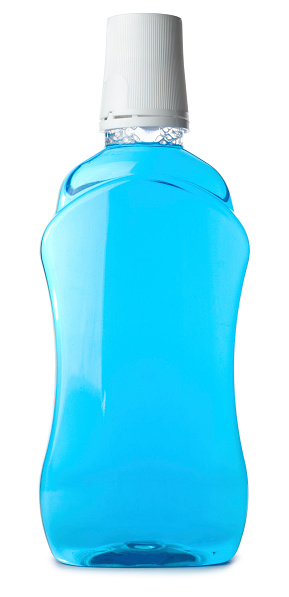 A bottle of blue Mouth Wash isolated on a white background.