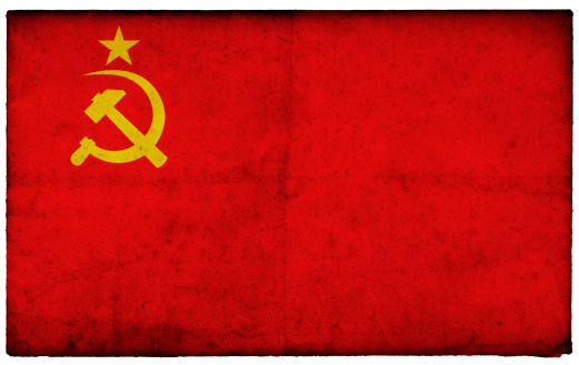 Grunge Former Soviet Union Flag on rough edged old postcard