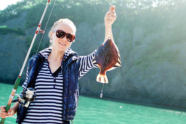 釣り - fisherwoman ストックフォトと画像