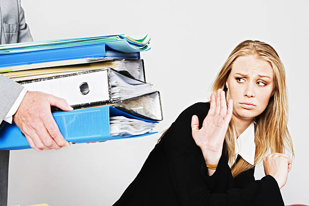 istock Enough already: businesswoman refuses extra work being handed over 185065225