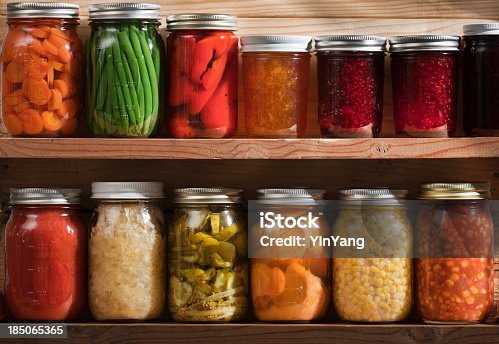 istock Home Canning, Preserving, Pickling Food Stored on Wooden Storage Shelves 185065365