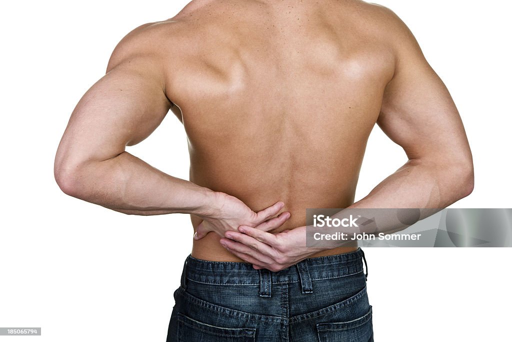 Hombre con dolor de espalda - Foto de stock de 20 a 29 años libre de derechos