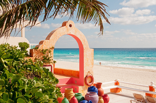 Coloful Mexican pottery and architecture on the beach in Cancun.