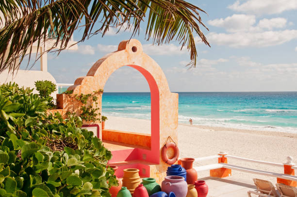 Colorful Mexican pottery and beach stock photo