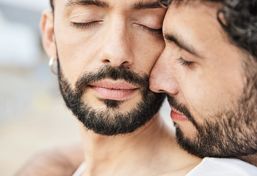 Close-up of an affectionate gay couple in love with each other. Concept of relationship