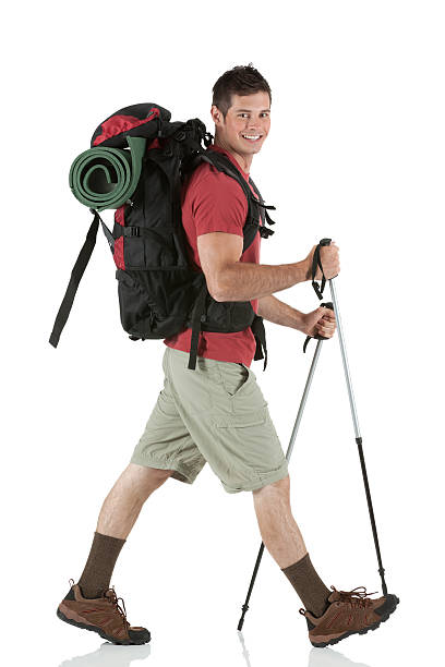 Male hiker walking with hiking poles