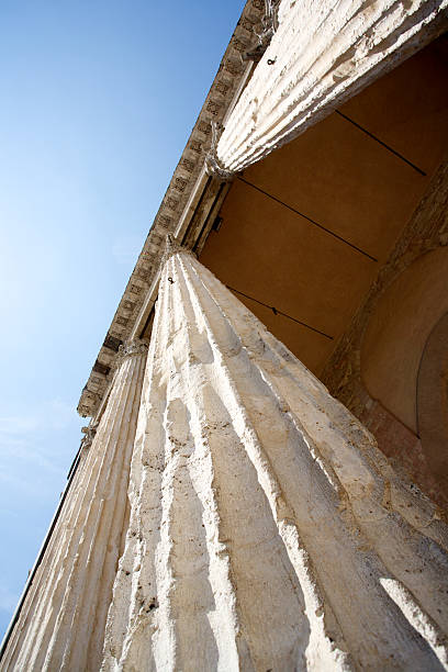 Temple Of Minerva In Assisi The columns of the Temple of Minerva in Assisi. Umbria, Italy. umbria architecture assisi corinthian stock pictures, royalty-free photos & images